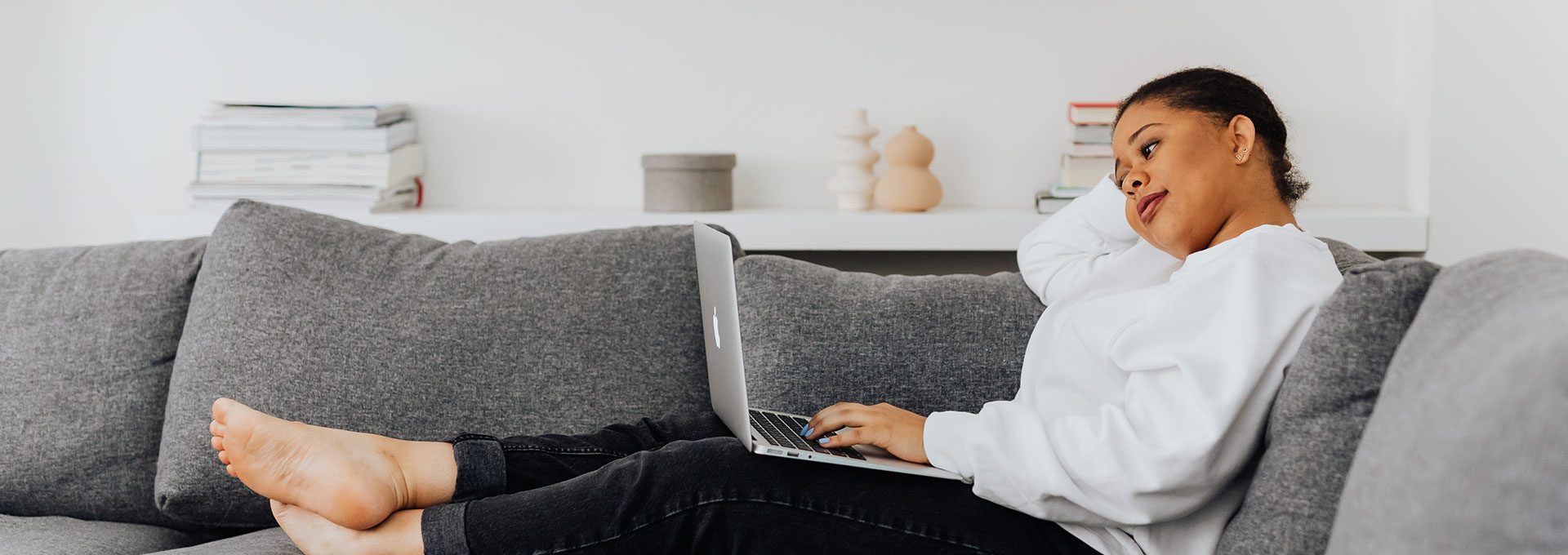 person sitting on couch in living room