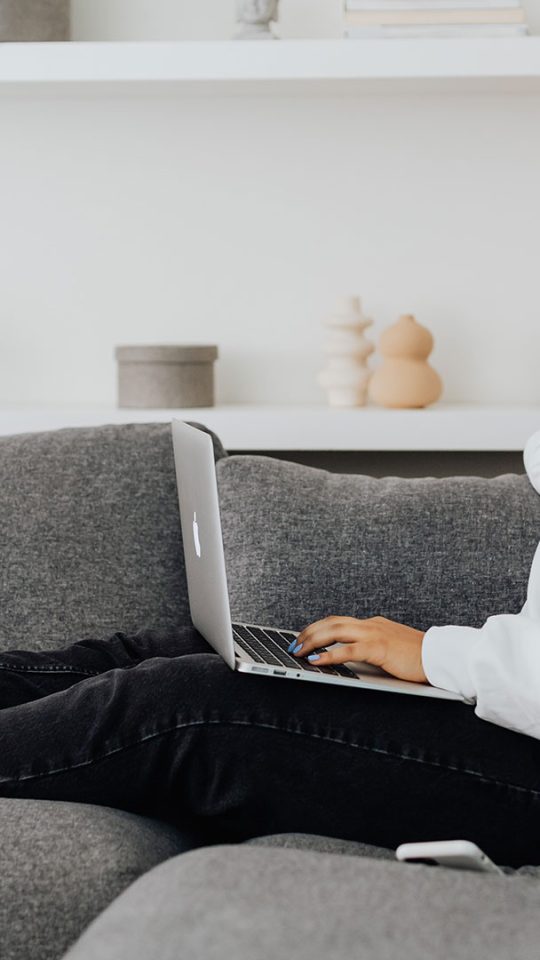 person sitting on couch in living room