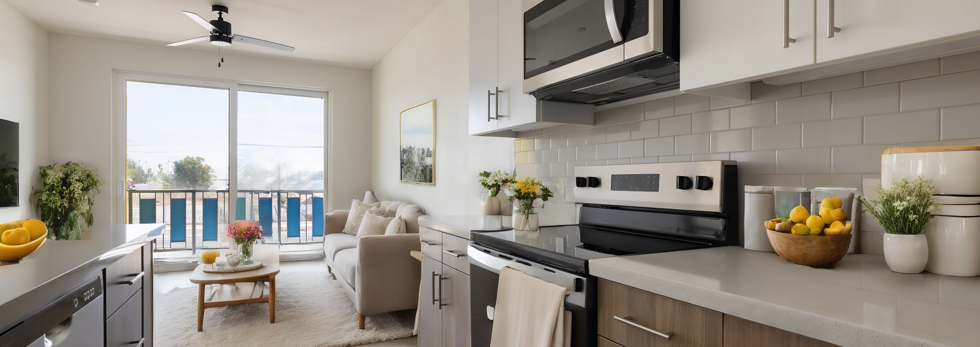 a kitchen with stainless steel appliances and a view of the ocean at The Blue at Eastline