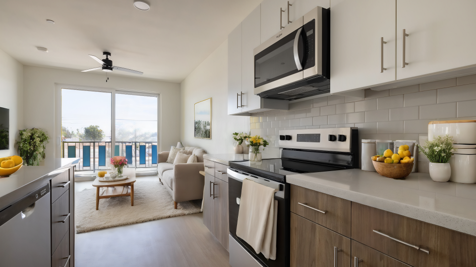 a kitchen with stainless steel appliances and a view of the ocean at The Blue at Eastline