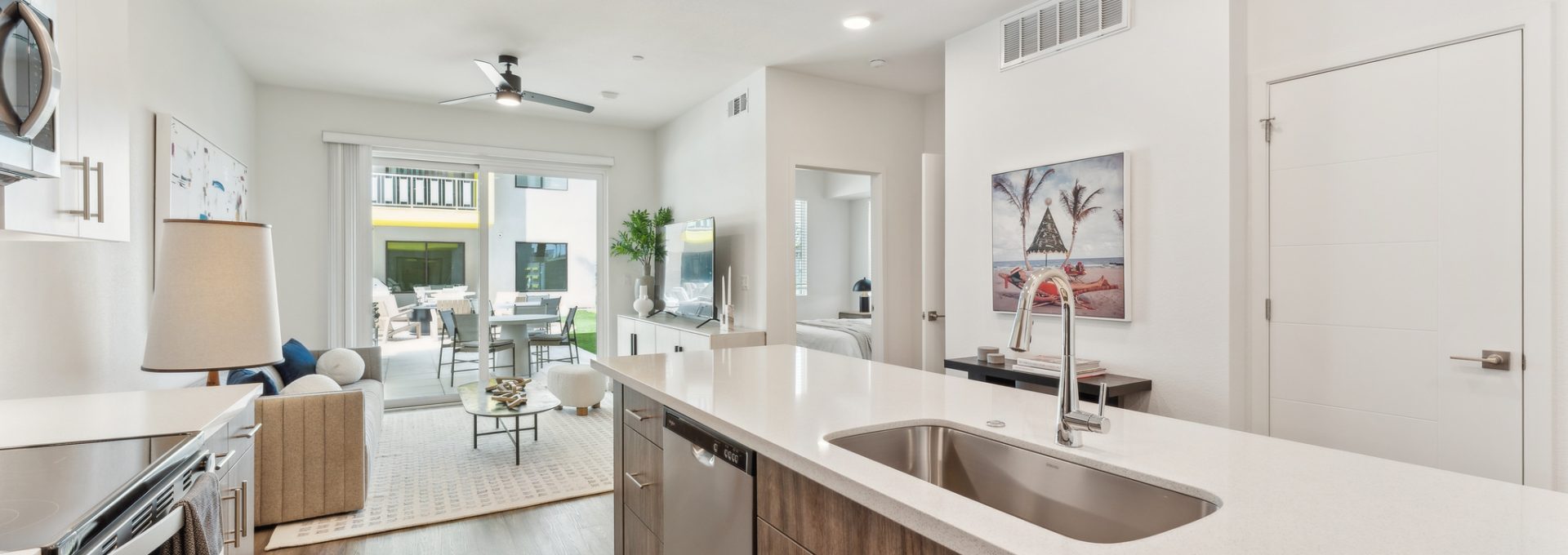 a kitchen with stainless steel appliances and a large island at The Blue Eastline