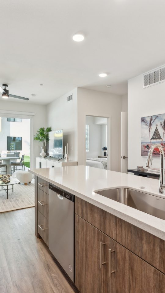 a kitchen with stainless steel appliances and a large island at The Blue Eastline